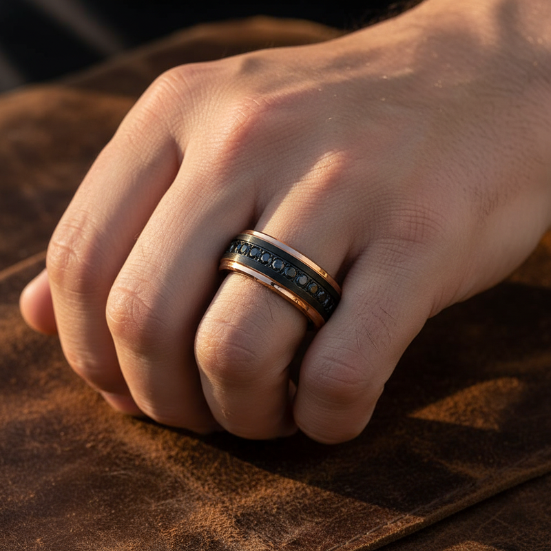 Prometheus black tungsten ring with rose gold edges and black CZ, front view