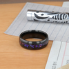 Naxos black tungsten alexandrite ring, worn on hand
