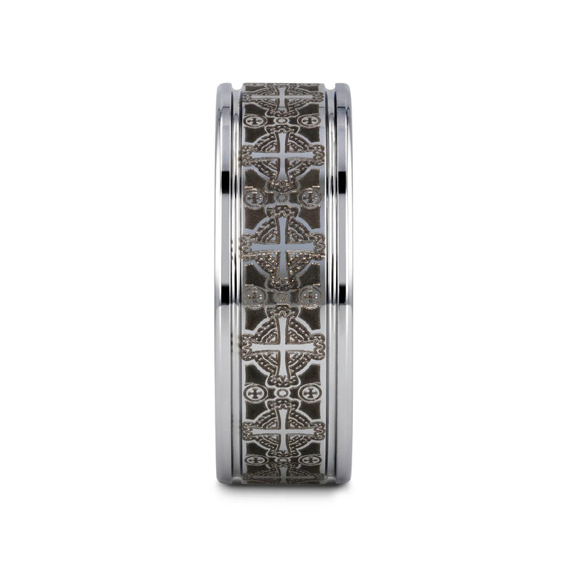 Tungsten carbide ring with intricate design on a white background