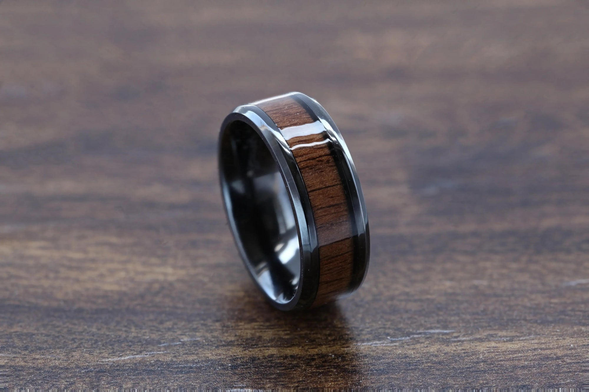 Delphi black titanium black walnut wood ring, angle view