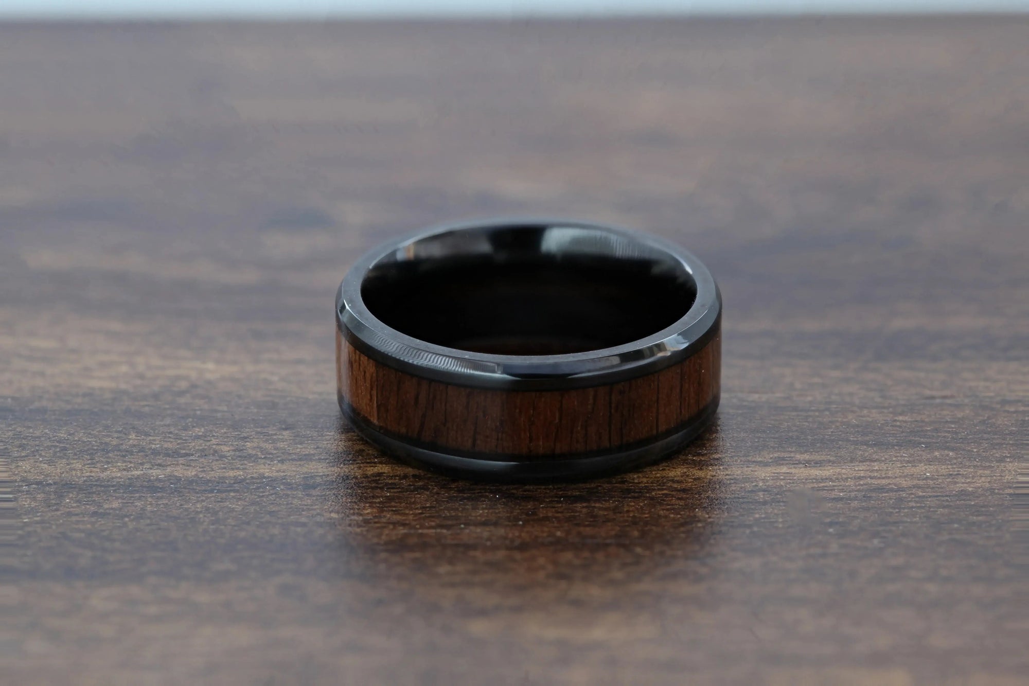 Delphi black titanium black walnut wood ring, close-up grain