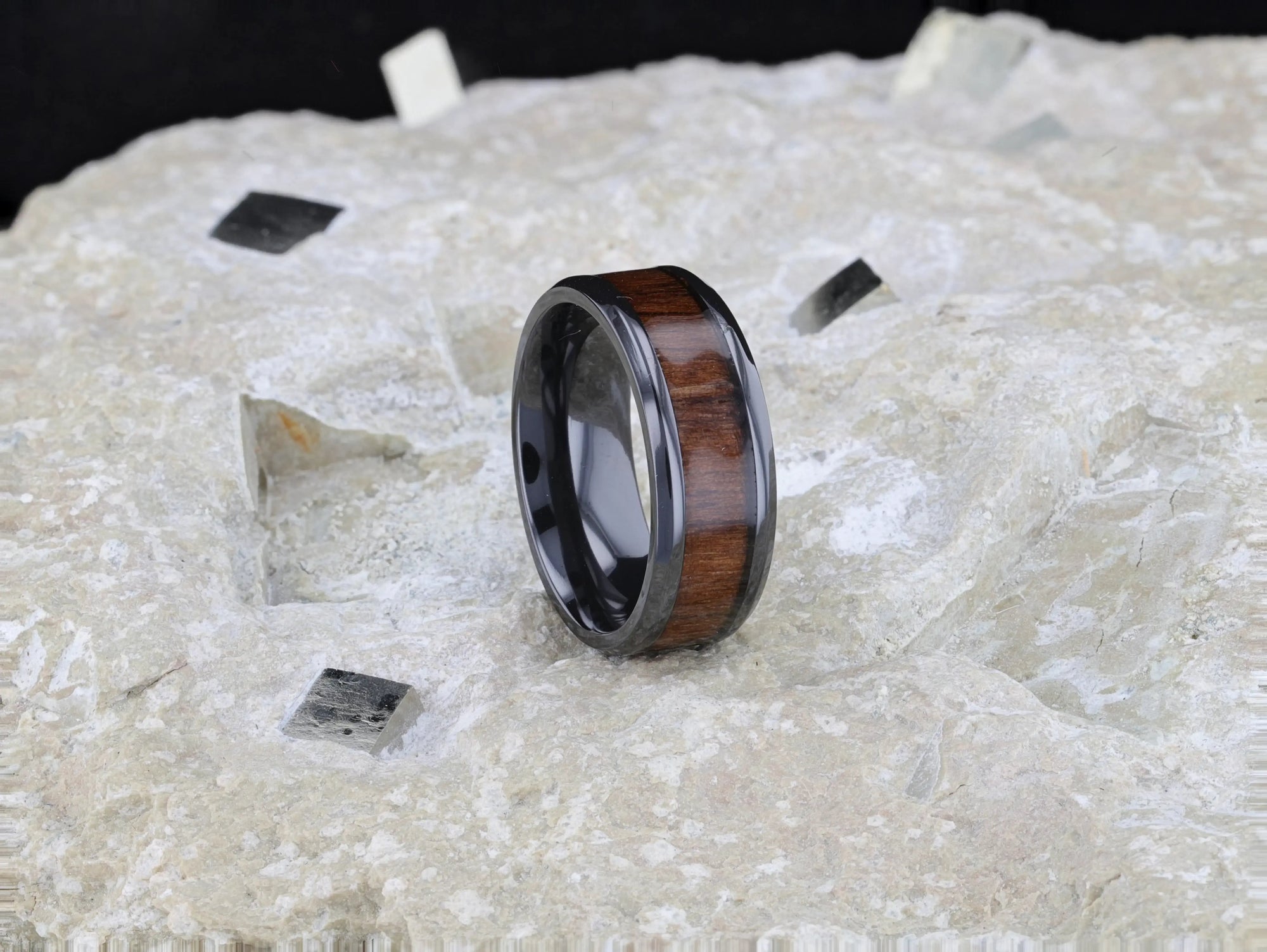 Delphi black titanium black walnut wood ring, worn on hand