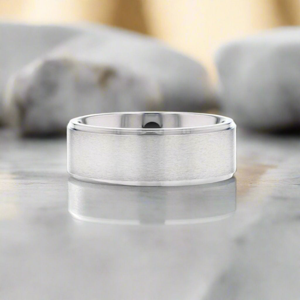 Shu titanium ring with brushed raised center, detail view